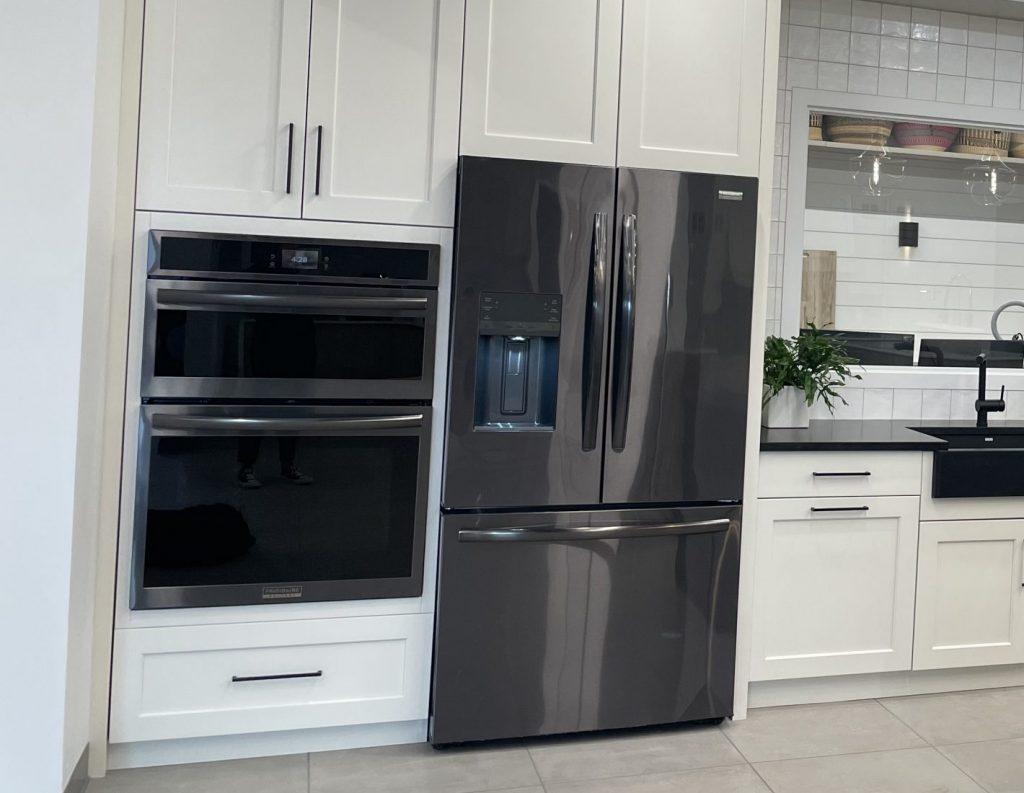 Modern kitchen that features a microwave and oven combo unit.
